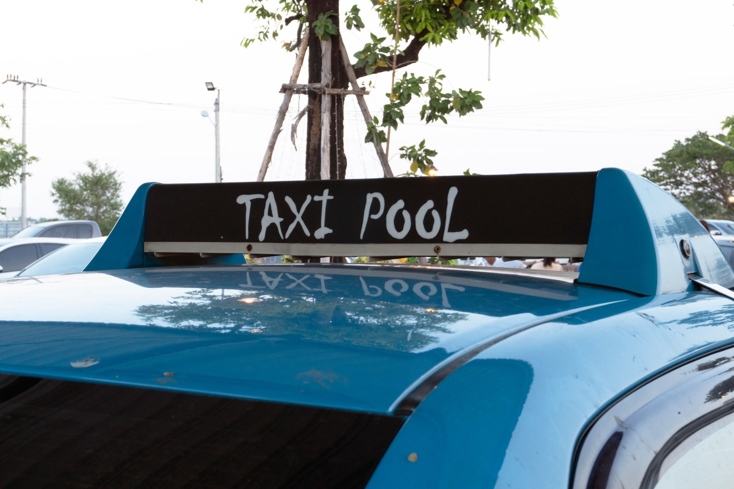 Taxi Pool sign on car roof
